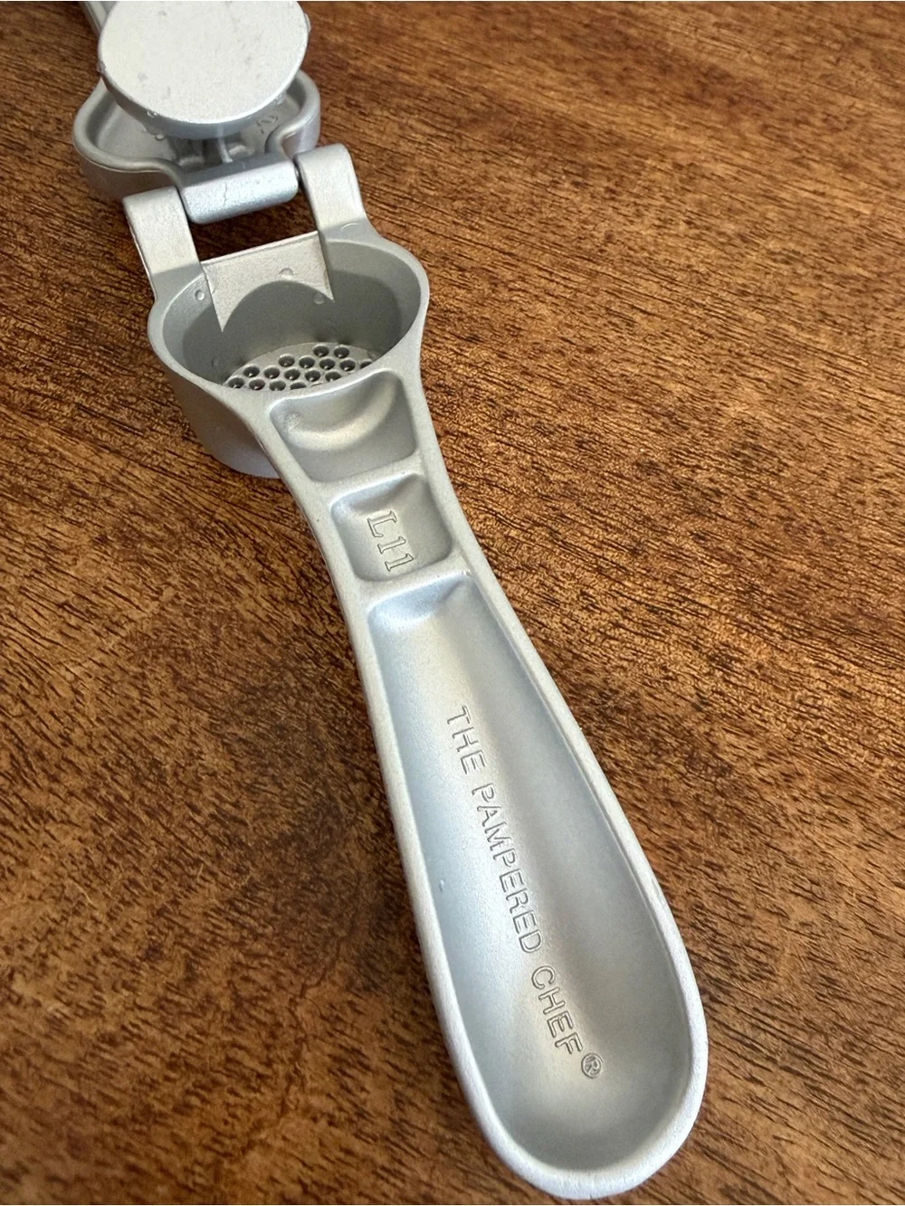 The PAMPERED CHEF Cast Aluminum Garlic Press